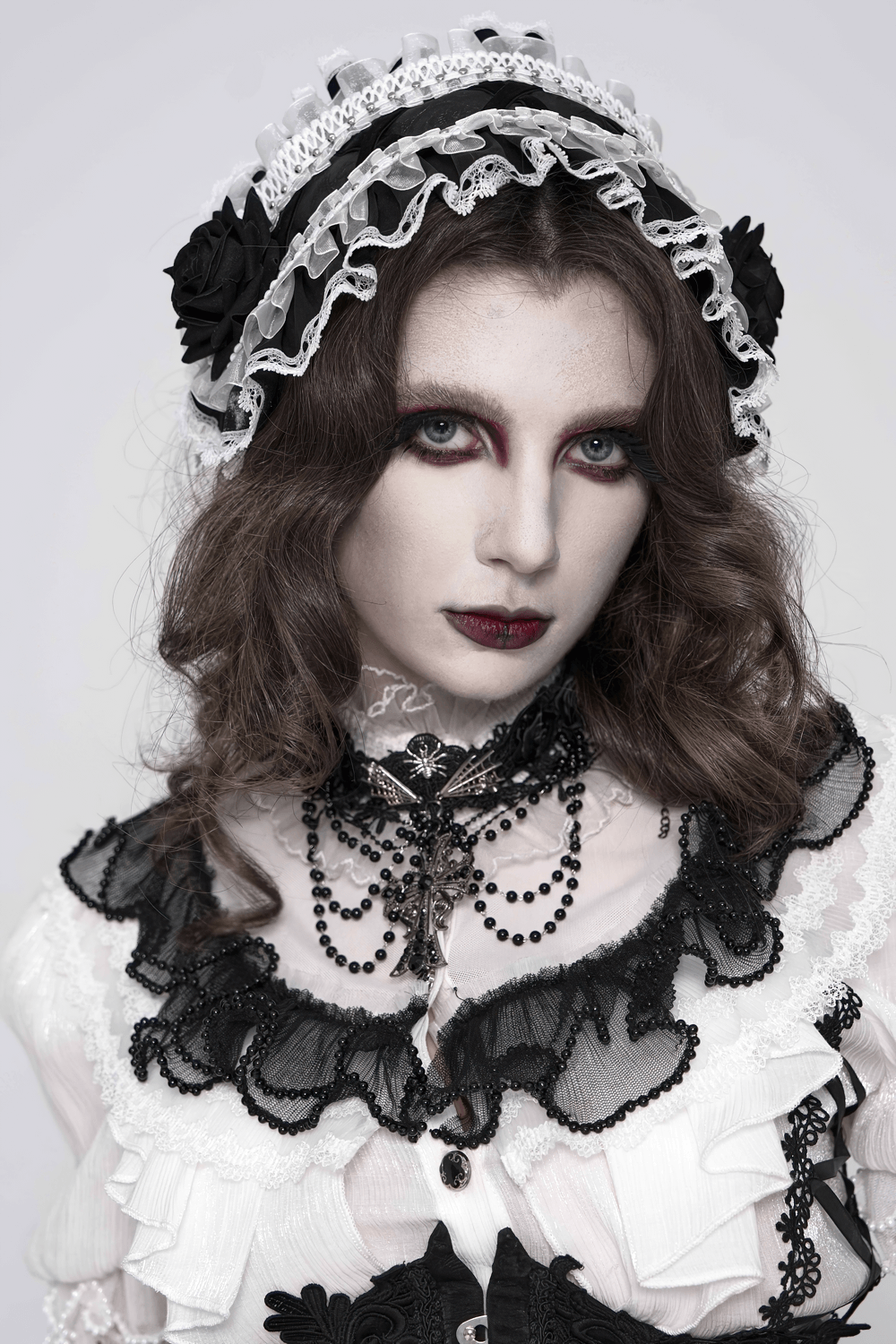 Gothic Lace Choker Necklace with Cross Pendant worn in a dark romantic fashion style, featuring rose lace and layered beaded drapes.