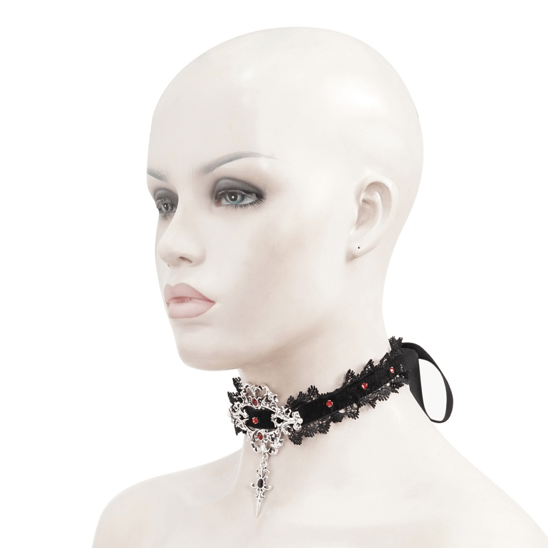 Gothic lace choker necklace with silver cross pendant and red beads, modeled on a mannequin.