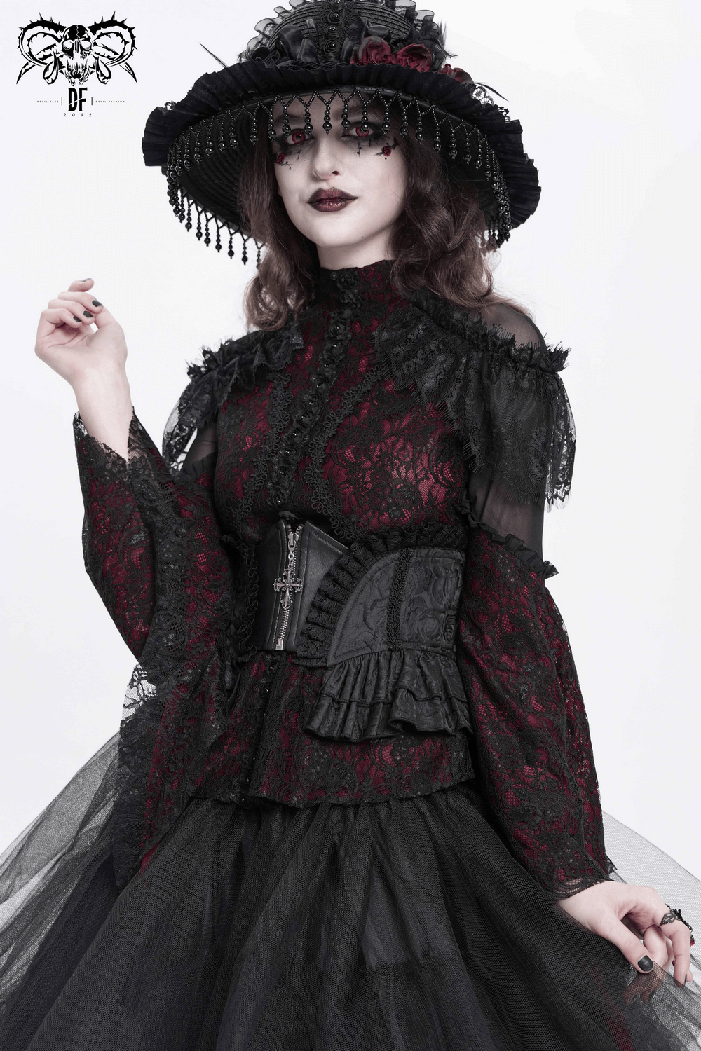 Gothic lace corset belt with zipper and cross details, styled with Victorian brocade top and dramatic ruffles.