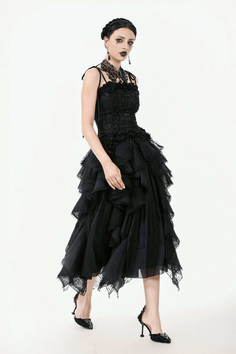 Gothic lace corset top with adjustable straps and ruffled black skirt, perfect for a dark romantic look.
