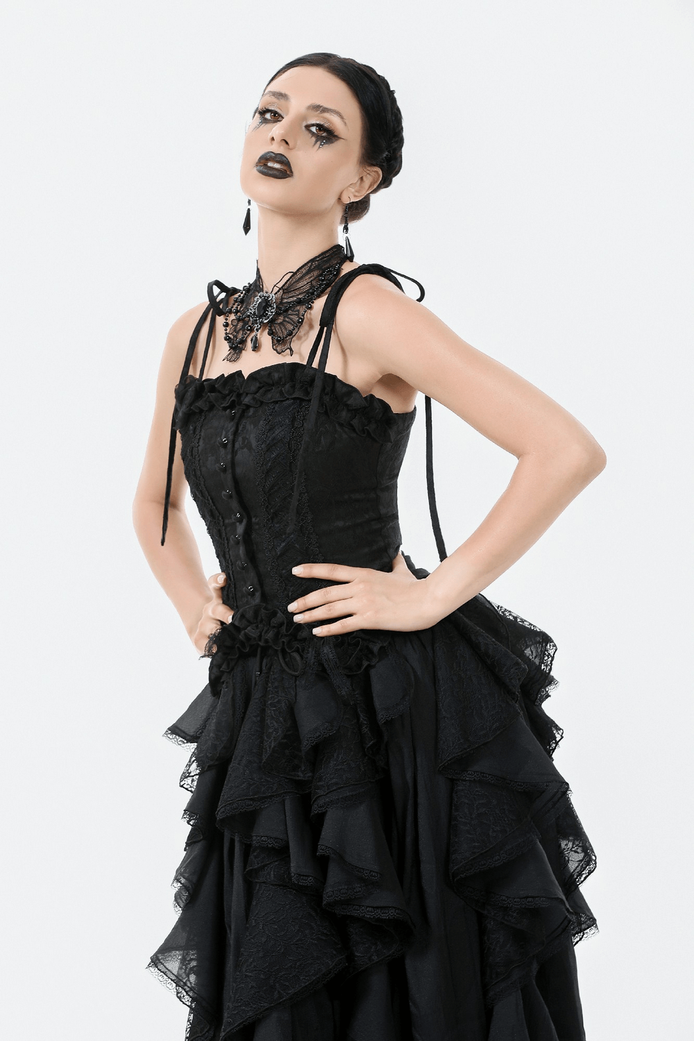 Elegant model in a gothic lace corset top with adjustable straps, showcasing dark romance and vintage style.