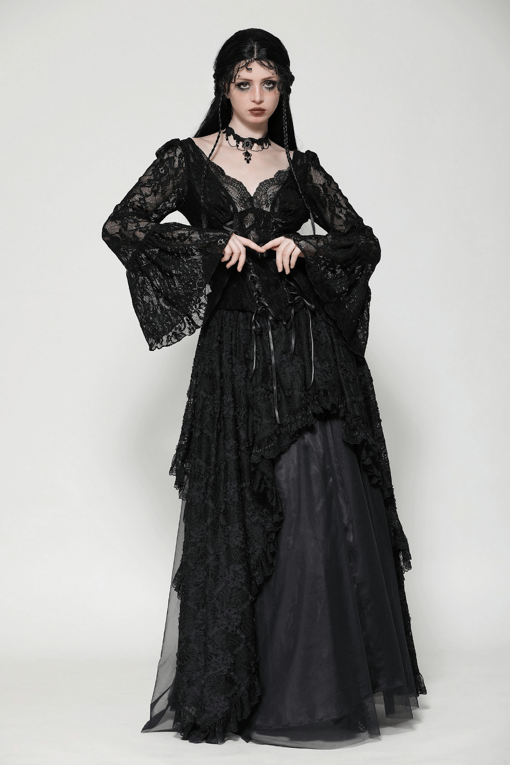 Gothic lace corset top with bell sleeves and tie accents, Victorian-inspired black lace fashion, dramatic vintage style.