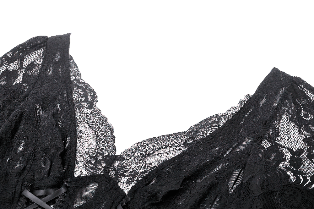 Close-up of intricate black lace on a gothic corset top with elegant tie accents.