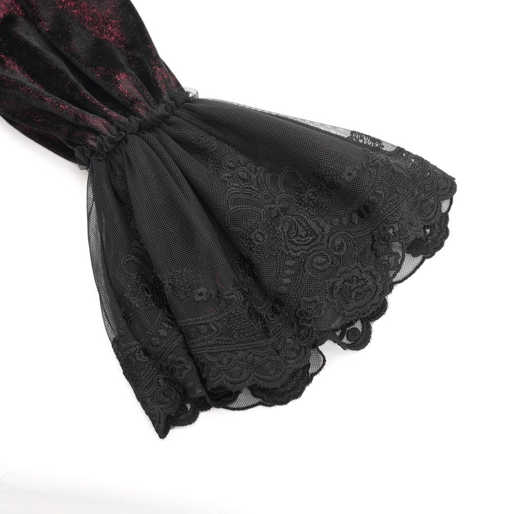 Close-up of intricate black lace trim with floral detailing on a gothic Victorian sleeve. Perfect for a dark fashion statement.