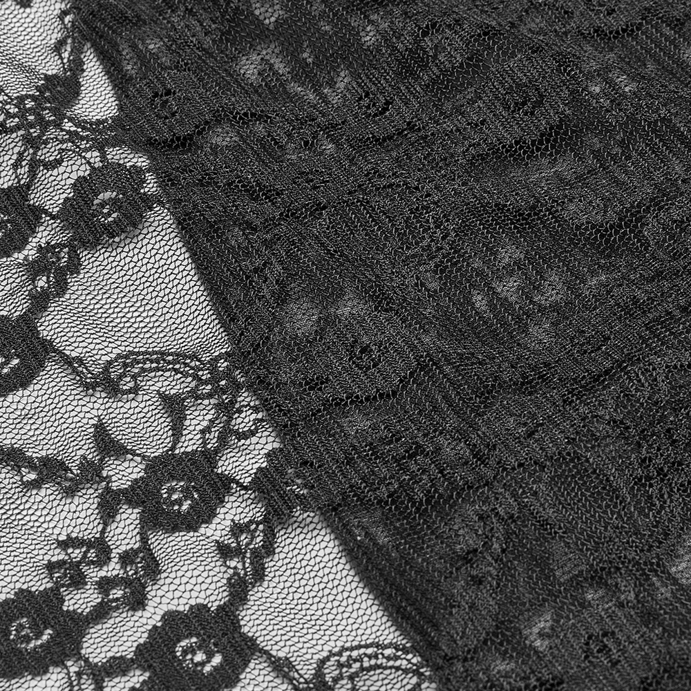 Close-up of intricate black lace fabric featuring floral patterns for a gothic style dress.