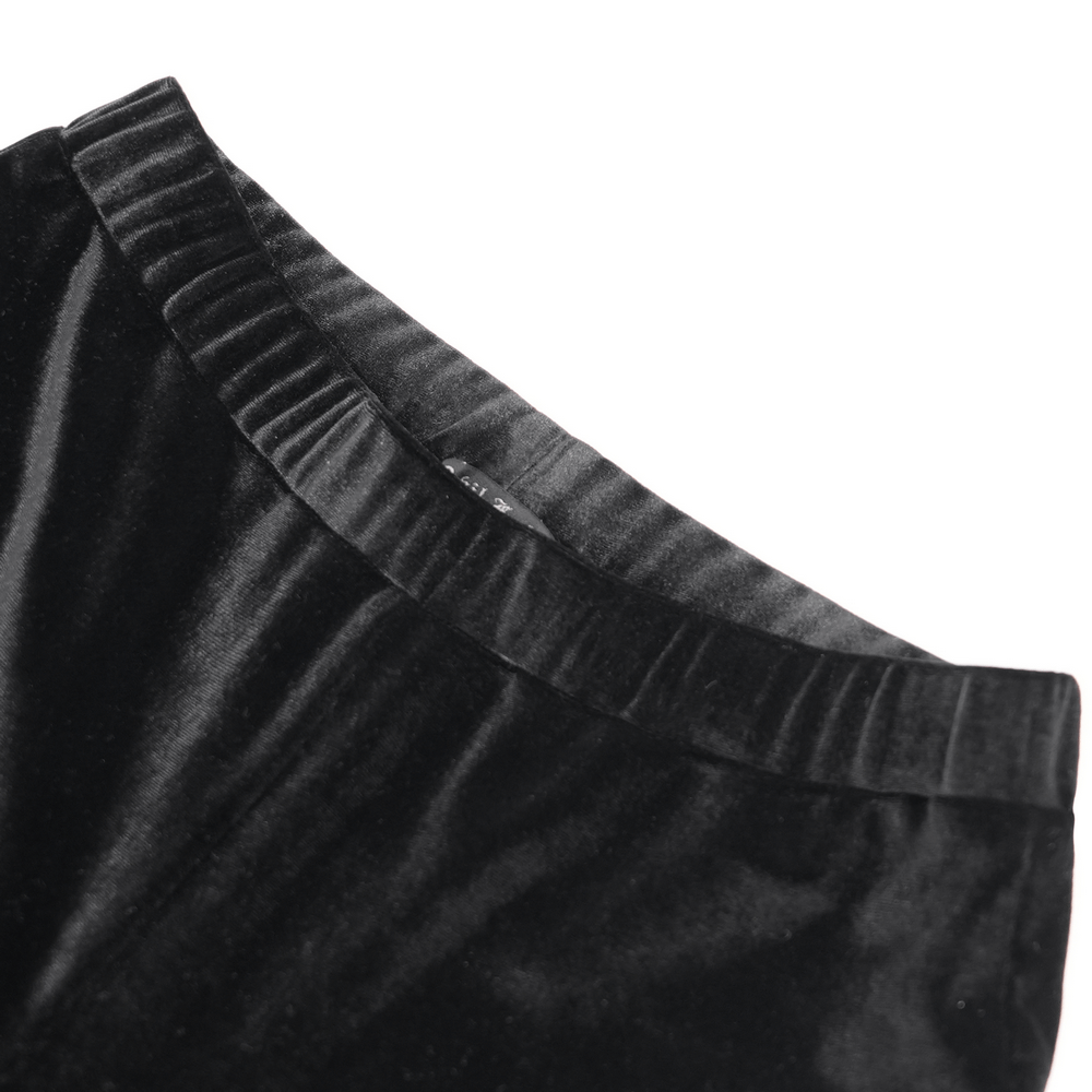 Close-up of the waistband of gothic velvet flare pants, showcasing luxurious fabric and elegant design details.