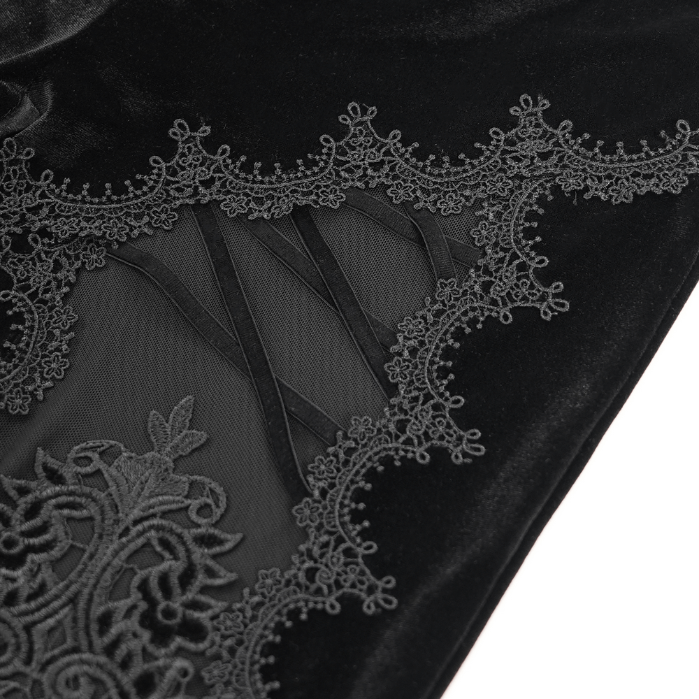 Close-up of gothic lace flare pants showcasing intricate lace and velvet detailing with embroidered accents.