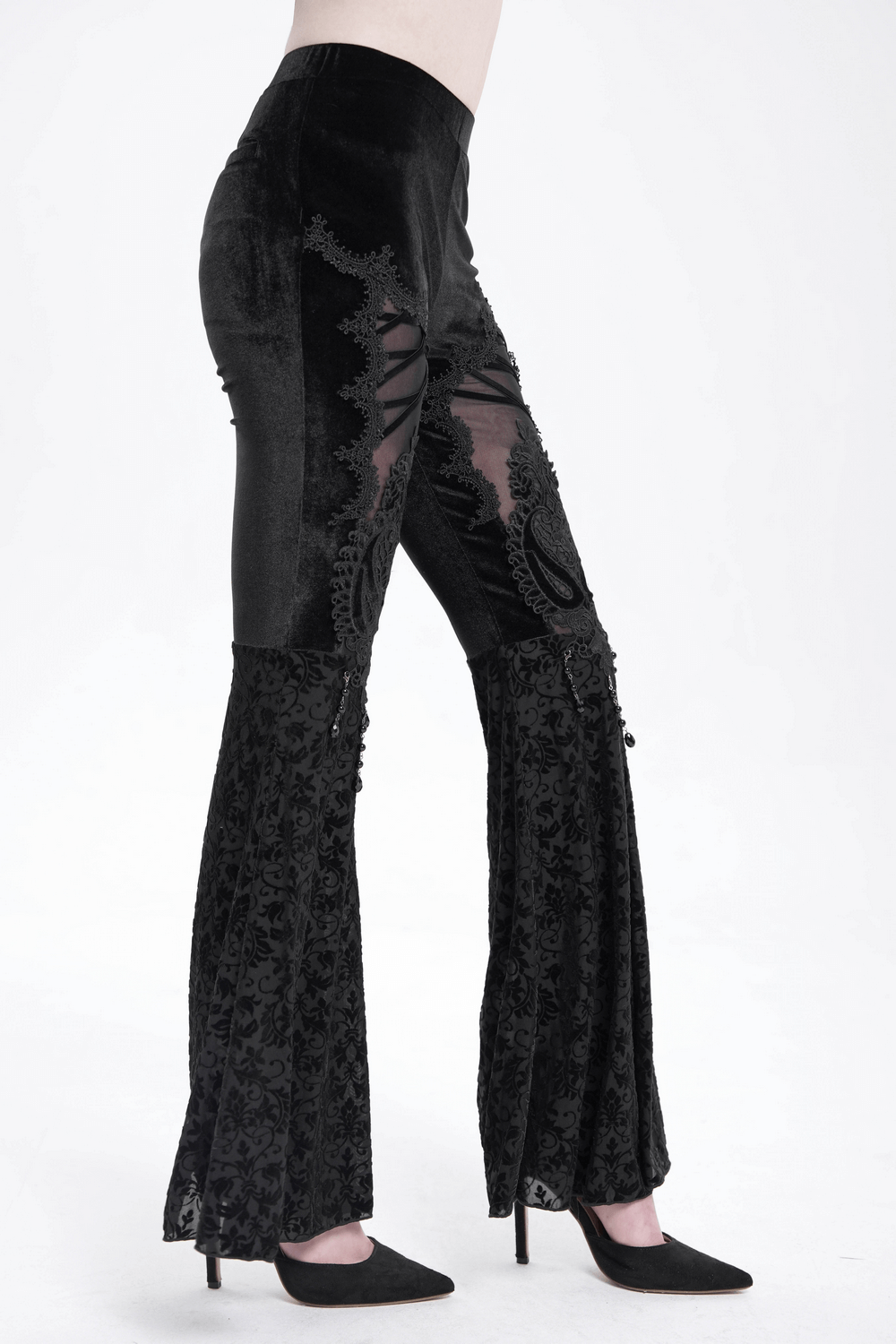 Gothic lace flare pants featuring velvet, sheer panels, and intricate embroidery for a bold, vintage-inspired look.