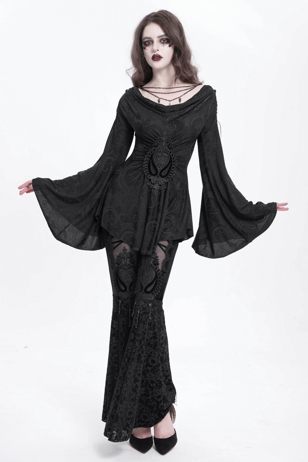 Gothic lace flare pants with velvet top, sheer lace panels, and embroidered details for a dramatic edgy style.