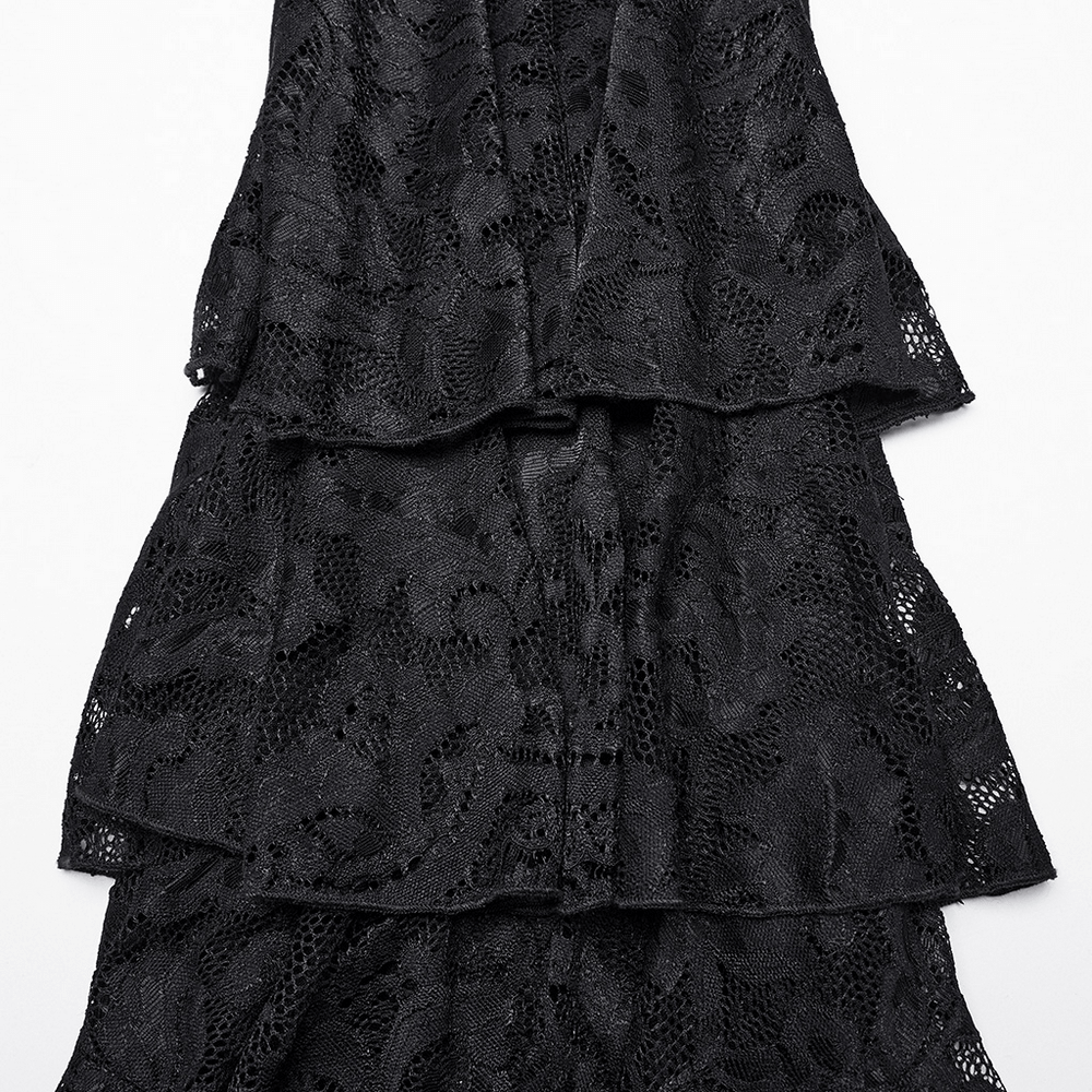 Close-up of layered black lace fabric showcasing intricate patterns and textures.