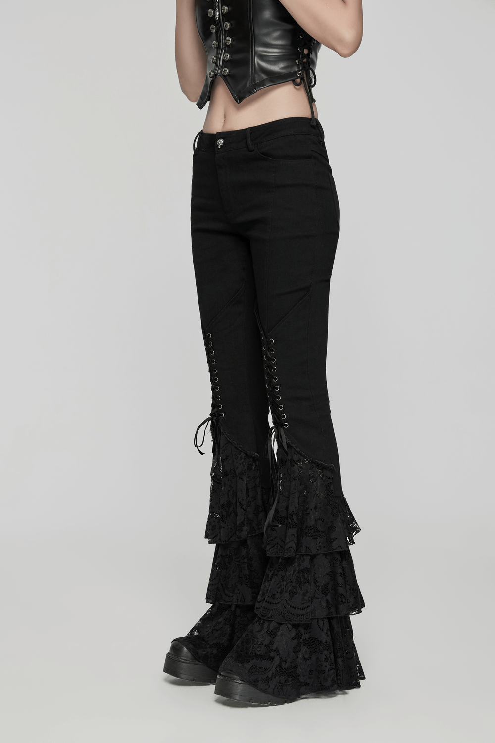 Gothic lace flared pants with V-shaped drawstring, showcasing edgy black denim with stacked lace hem.