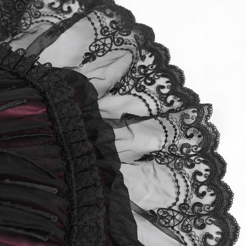 Close-up of black lace trim with elegant pattern on a gothic umbrella, showcasing its vintage-inspired design.