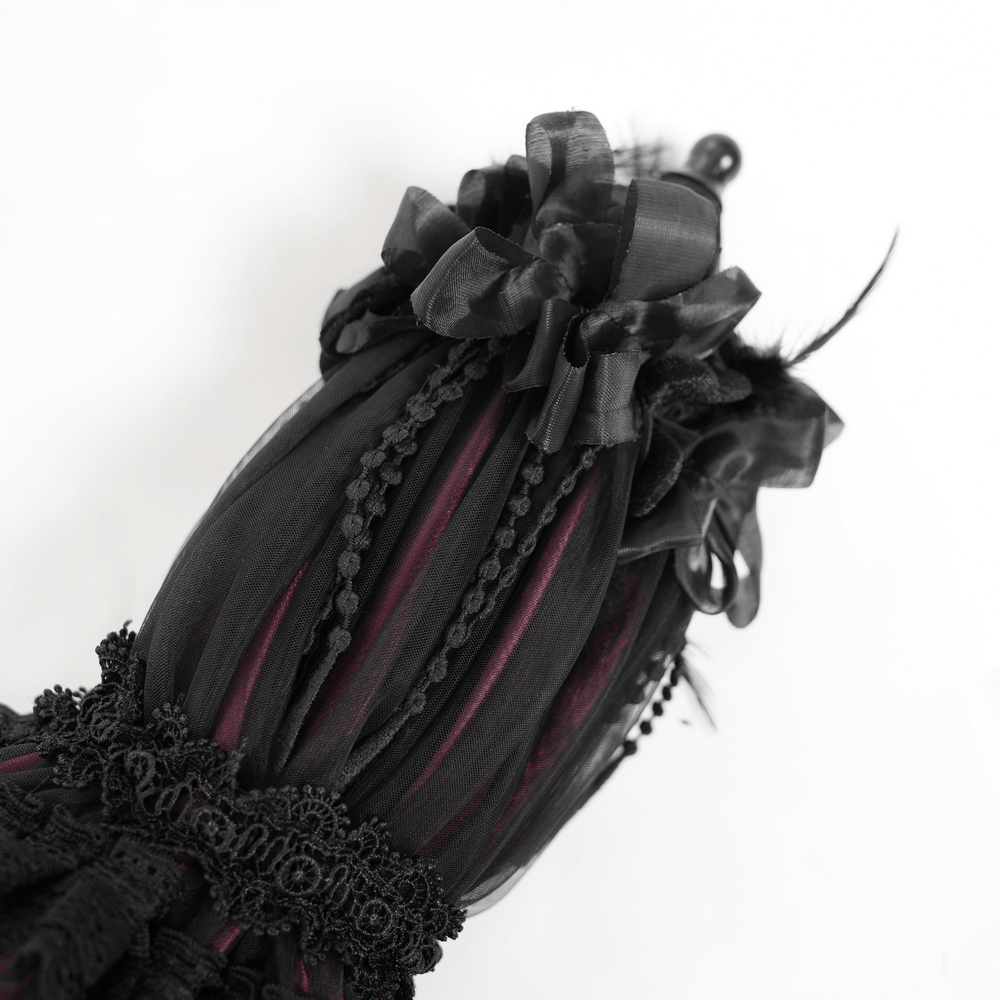 Elegant Gothic lace umbrella with black satin ribbons and delicate fringe detail.