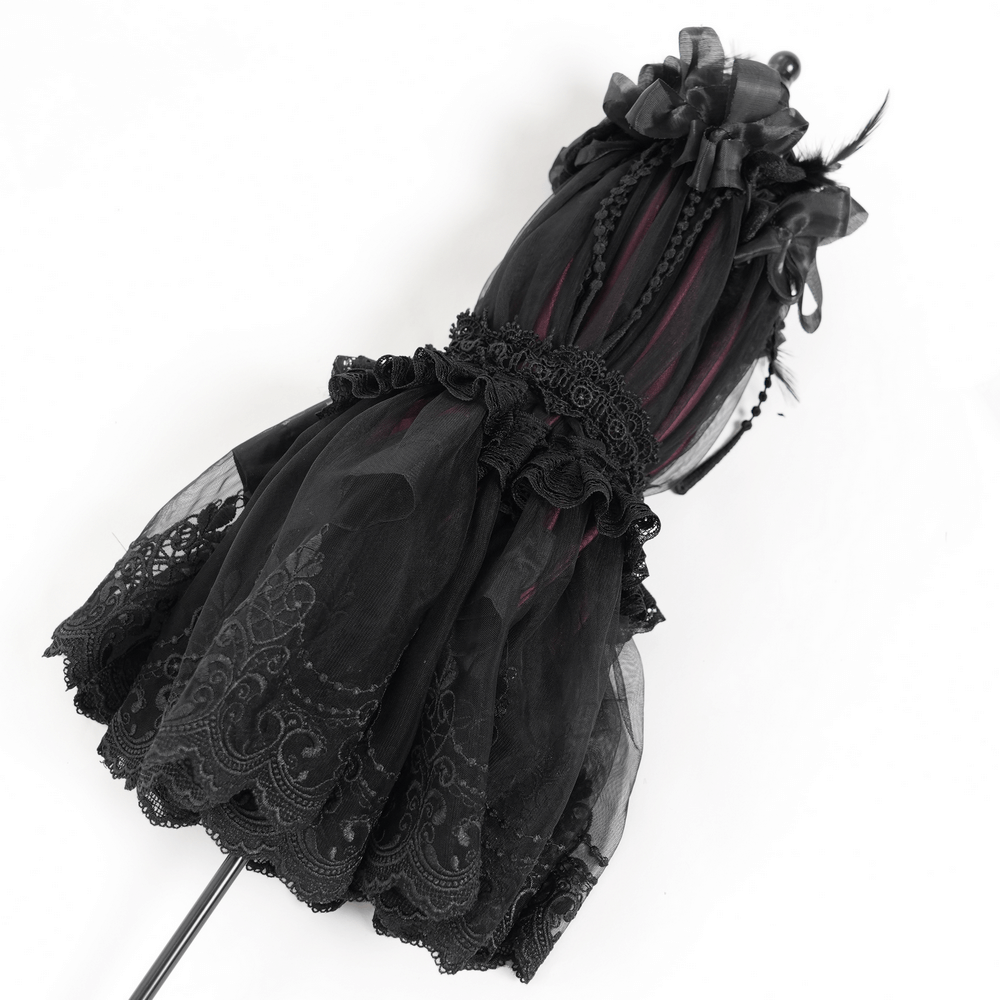 Elegant black lace umbrella with roses, satin details, and fringe, perfect for a gothic touch to any outfit.