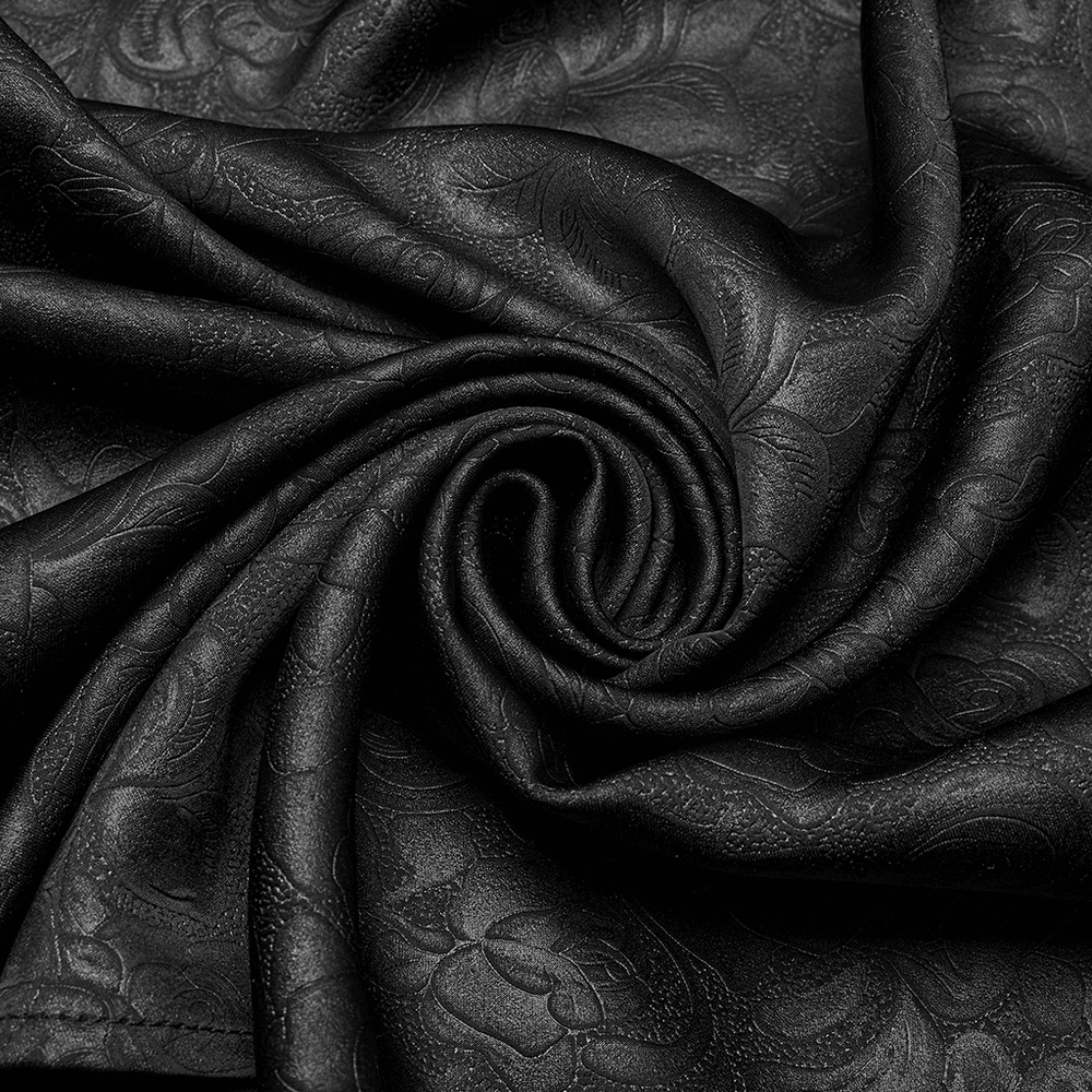 Close-up of soft black fabric with intricate dark rose pattern, ideal for gothic fashion.
