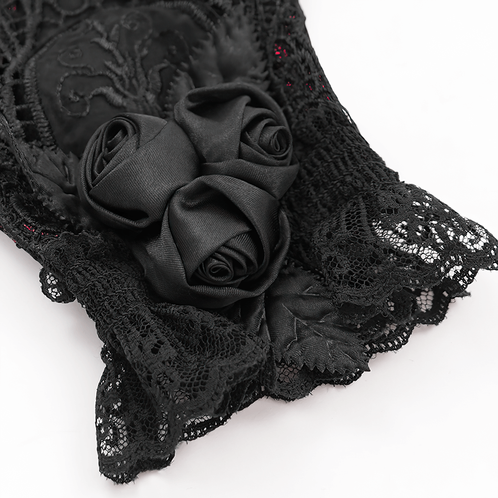 Close-up of Gothic lace gloves with black satin roses and intricate lace detailing for a Victorian look.