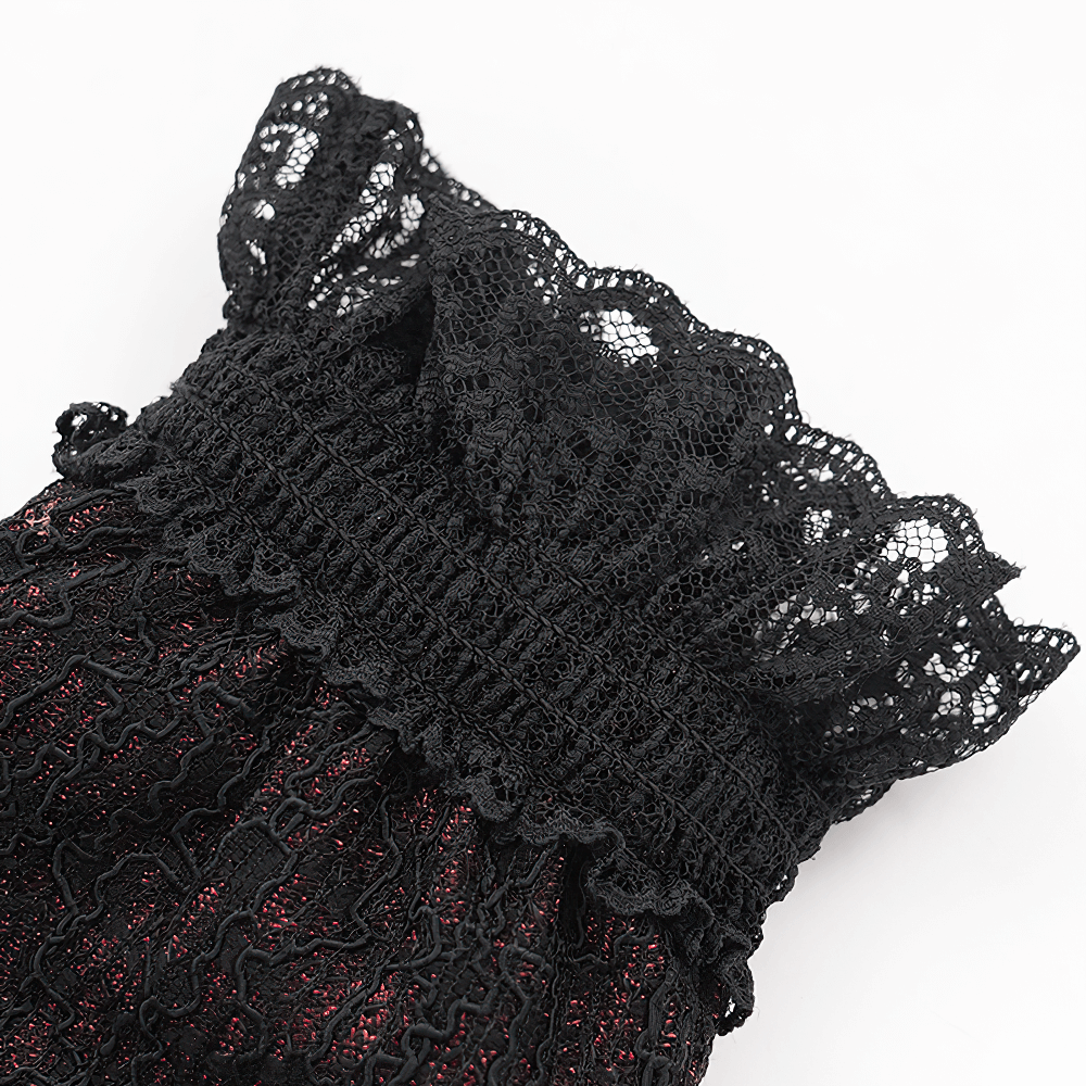 Gothic lace gloves with a ruffled black cuff, showcasing intricate black embroidery on a red lace base.