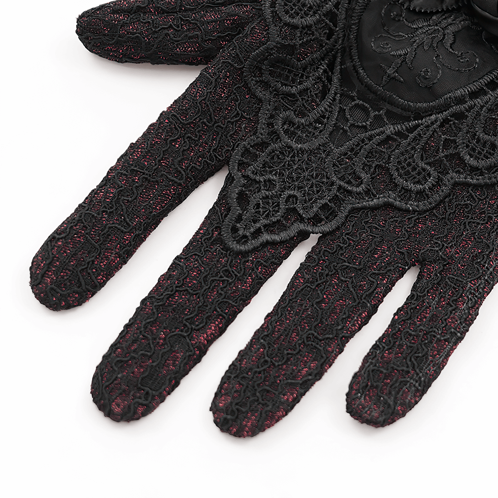 Gothic lace gloves in red and black with intricate embroidery and floral trim for a Victorian style look.