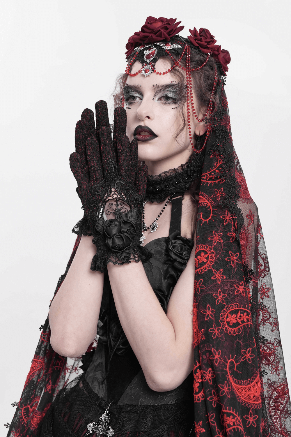 Gothic lace gloves with black roses, red lace, and mesh details, perfect for a dramatic Victorian look.