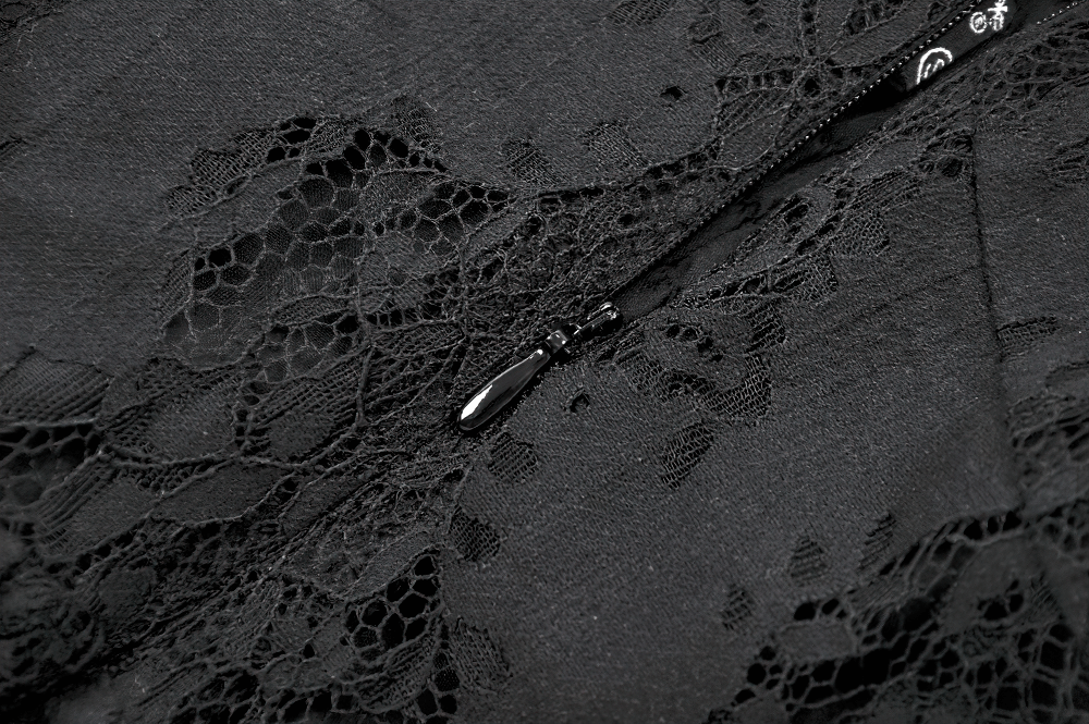 Close-up of black lace detail and hidden zipper on a gothic halter dress, showcasing dark romantic style.