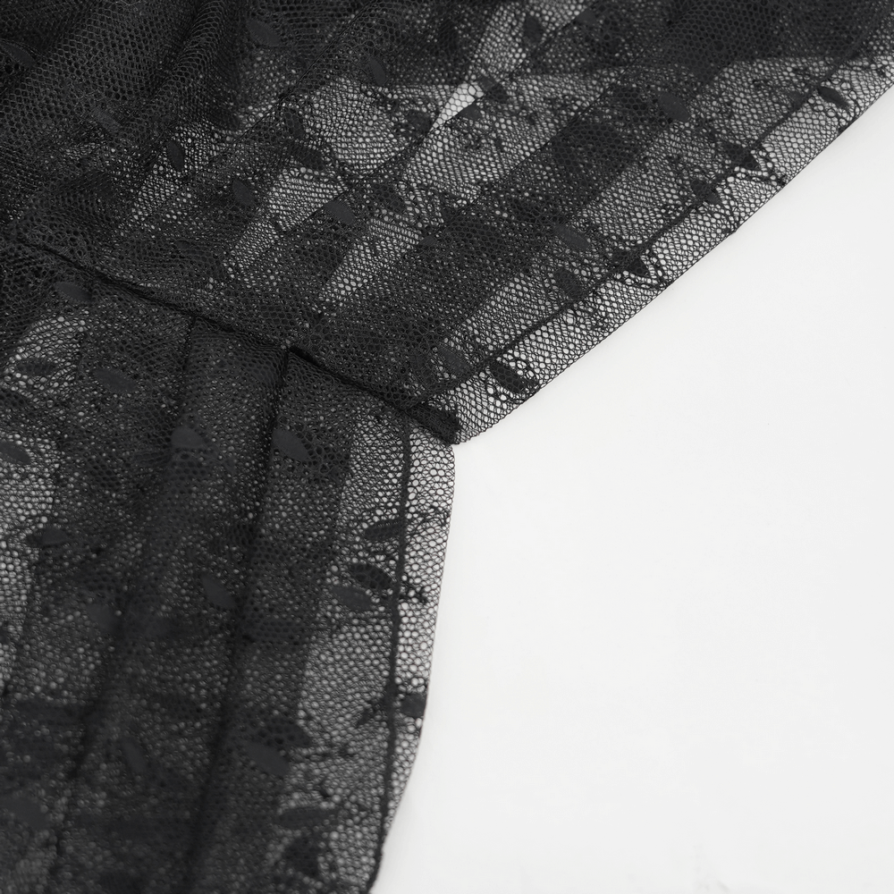 Close-up of elegant black lace fabric with intricate patterns, perfect for gothic fashion styles.