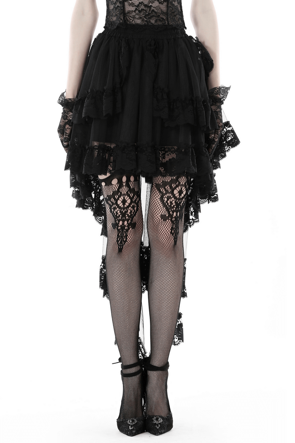 Gothic lace hi-low skirt with dramatic swallowtail hem, paired with fishnet stockings for a striking dark style.
