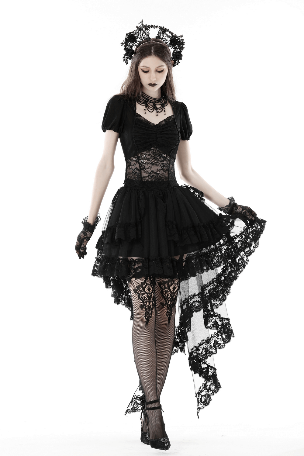 Gothic lace hi-low skirt with dramatic swallowtail hem, styled with black accessories for dark elegance.