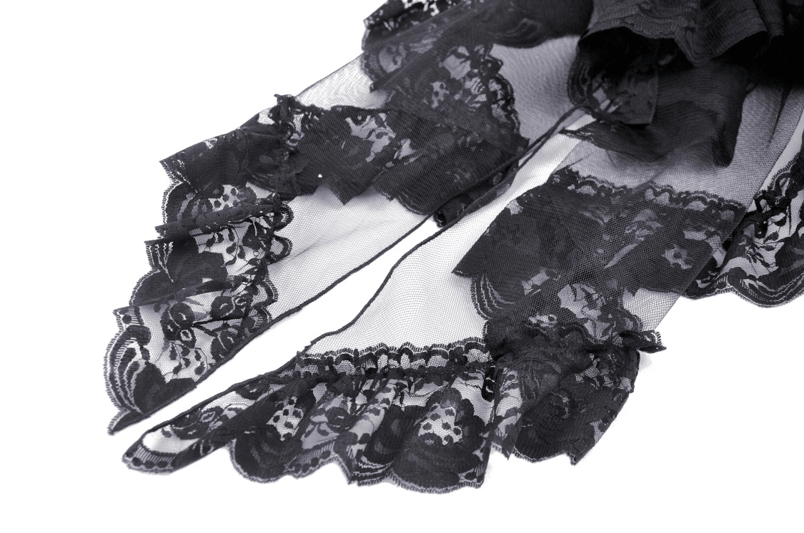 Close-up of black lace fabric with intricate patterns, showcasing the delicate design of a gothic skirt.