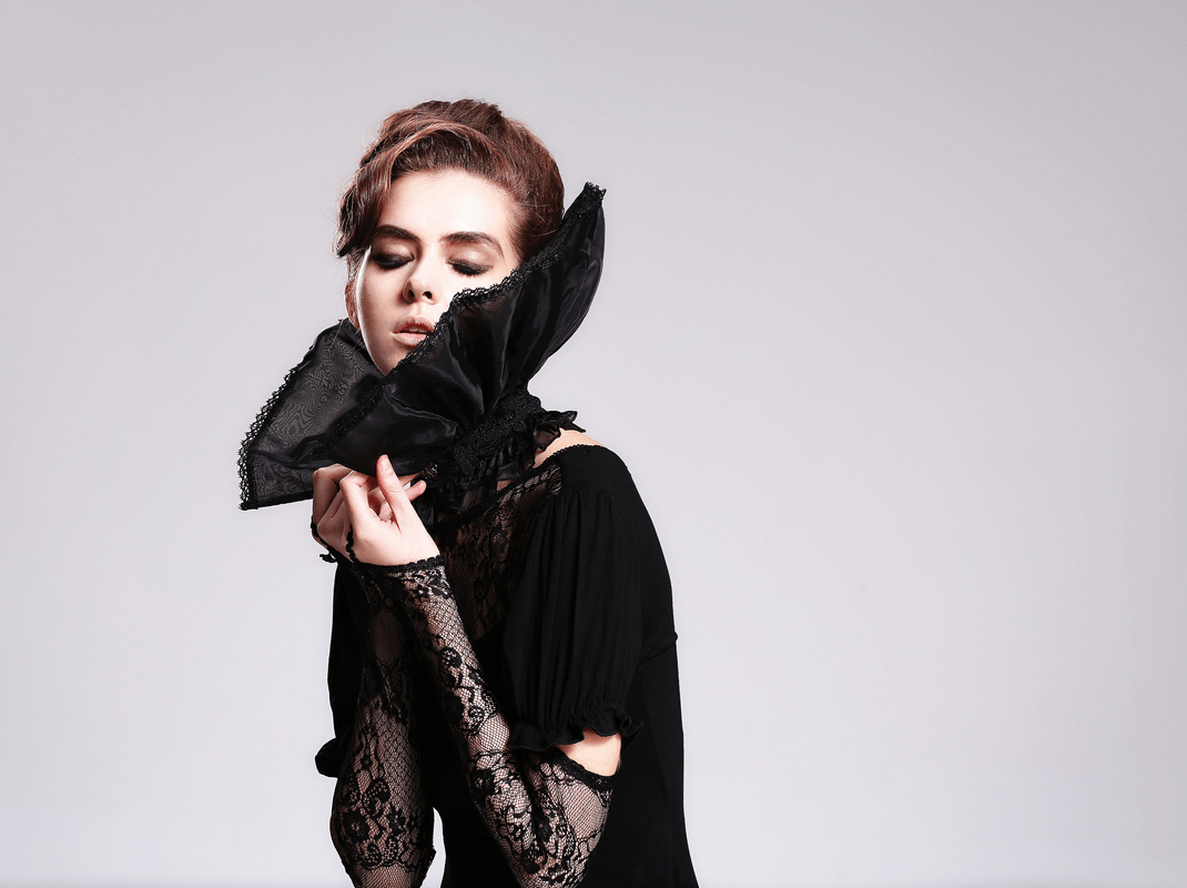Elegant woman in black lace high collar and sleeves, showcasing gothic vintage style and grace.