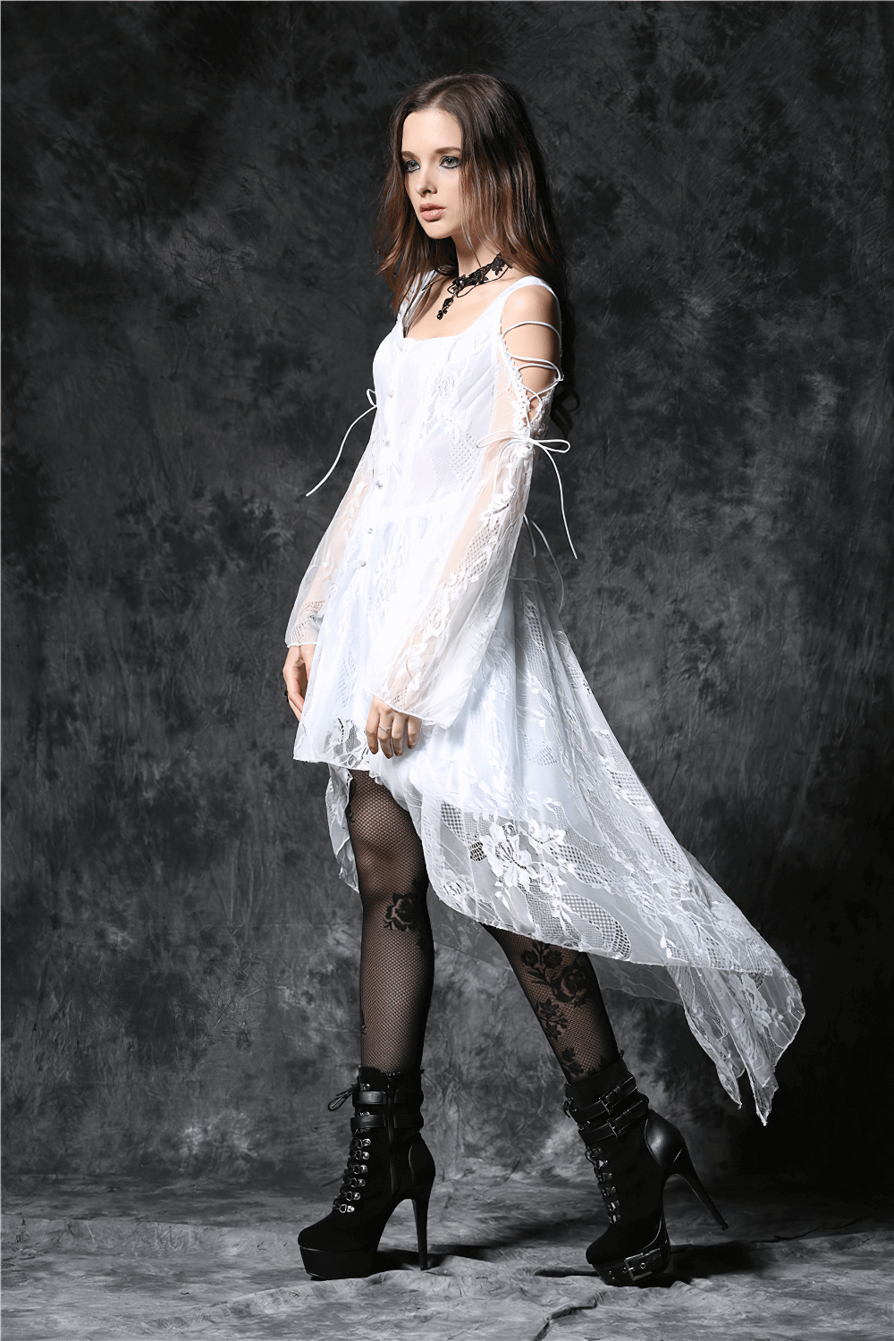 Gothic-inspired white high-low lace dress with sheer sleeves, perfect for a stylish night out.