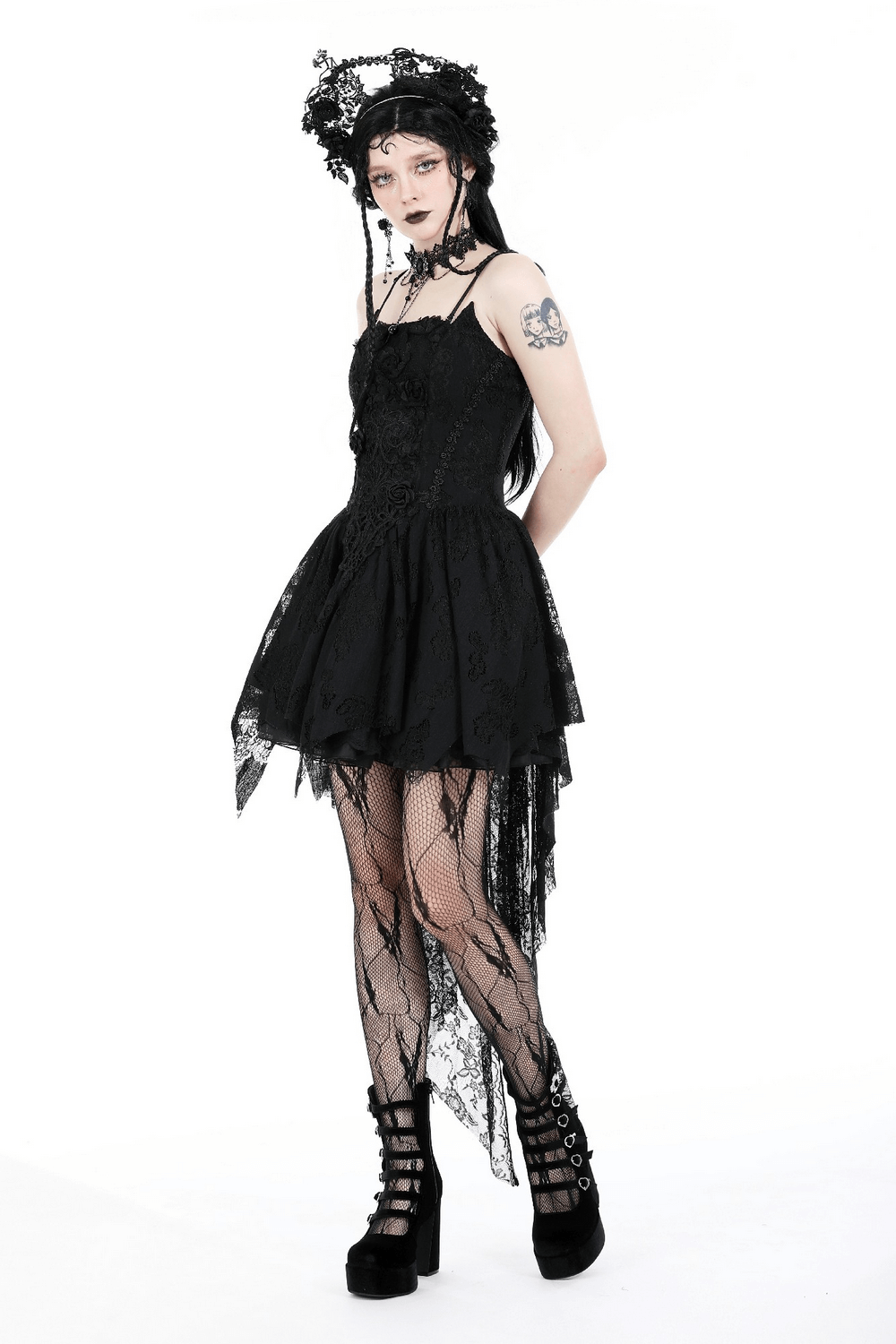 Gothic black lace high-low dress with straps, featuring a whimsical design and edgy accessories.