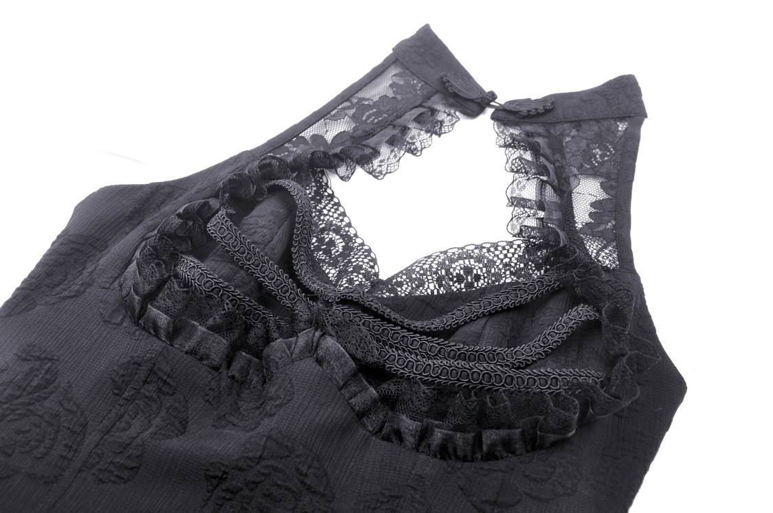 Close-up of gothic lace detailing on a high-low halter dress, showcasing intricate craftsmanship and vintage-inspired design.