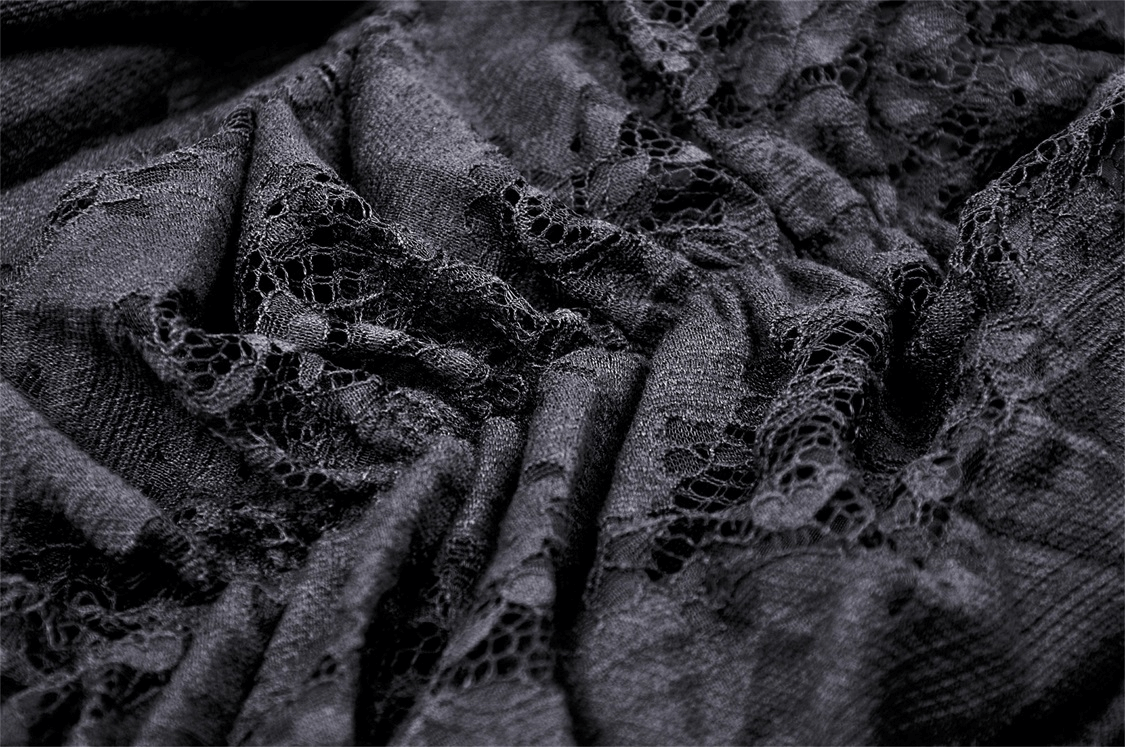 Close-up of delicate black lace fabric featuring romantic ruffles, perfect for a Gothic high-low skirt design.