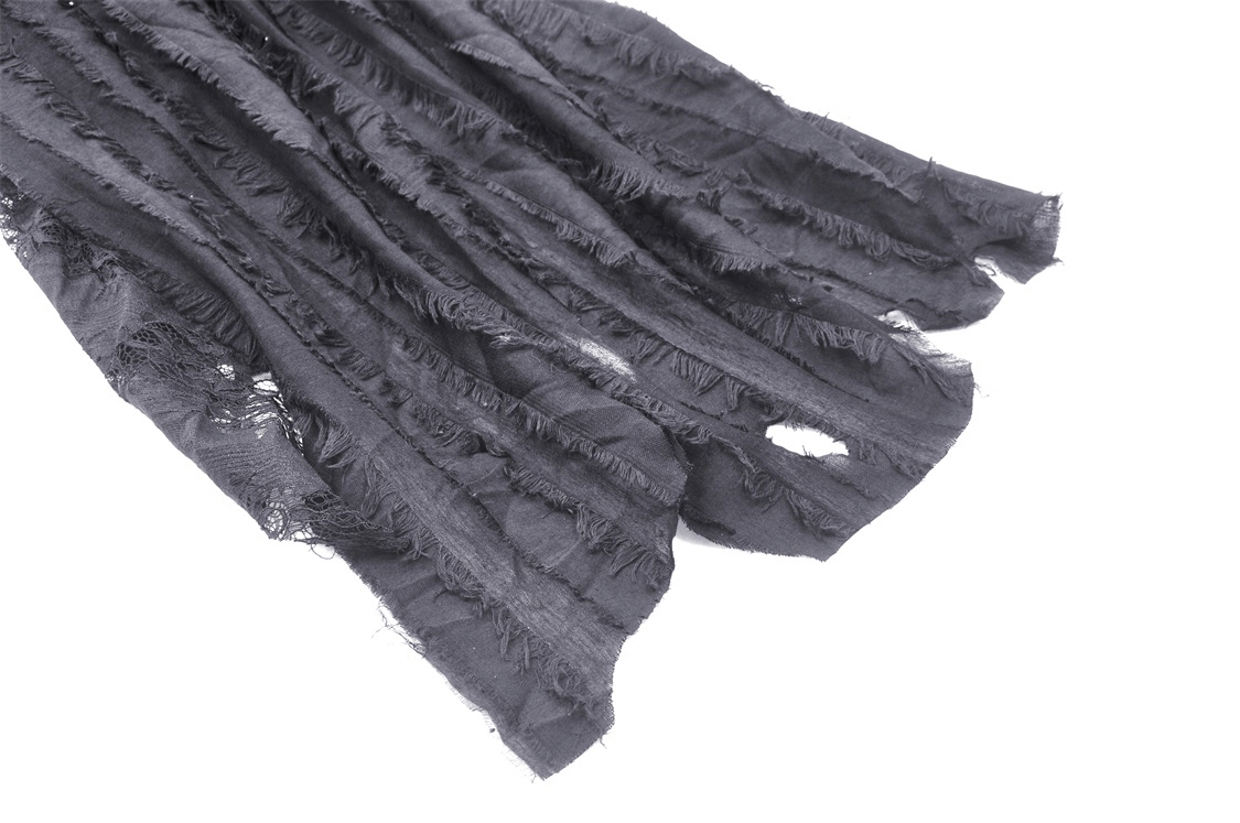 Textured black lace fabric with frayed edges, perfect for creating a gothic-inspired high-low skirt.