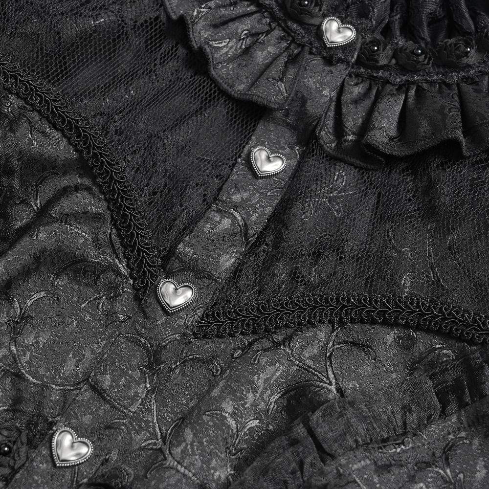 Gothic lace blouse detail featuring heart-shaped buttons and intricate floral jacquard fabric.