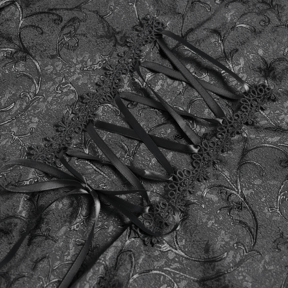 Corset back detail of Gothic lace blouse with floral jacquard pattern and black ribbons.