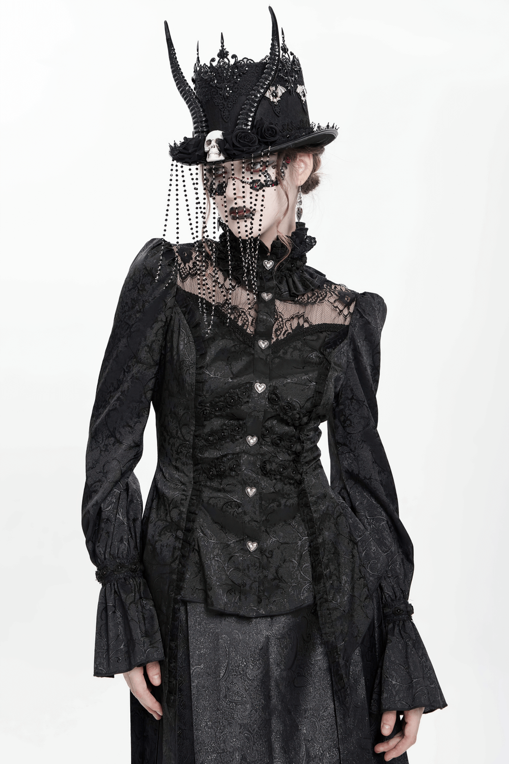 Victorian-inspired gothic blouse with lace, heart buttons, and dramatic puff sleeves for elegant dark fashion.