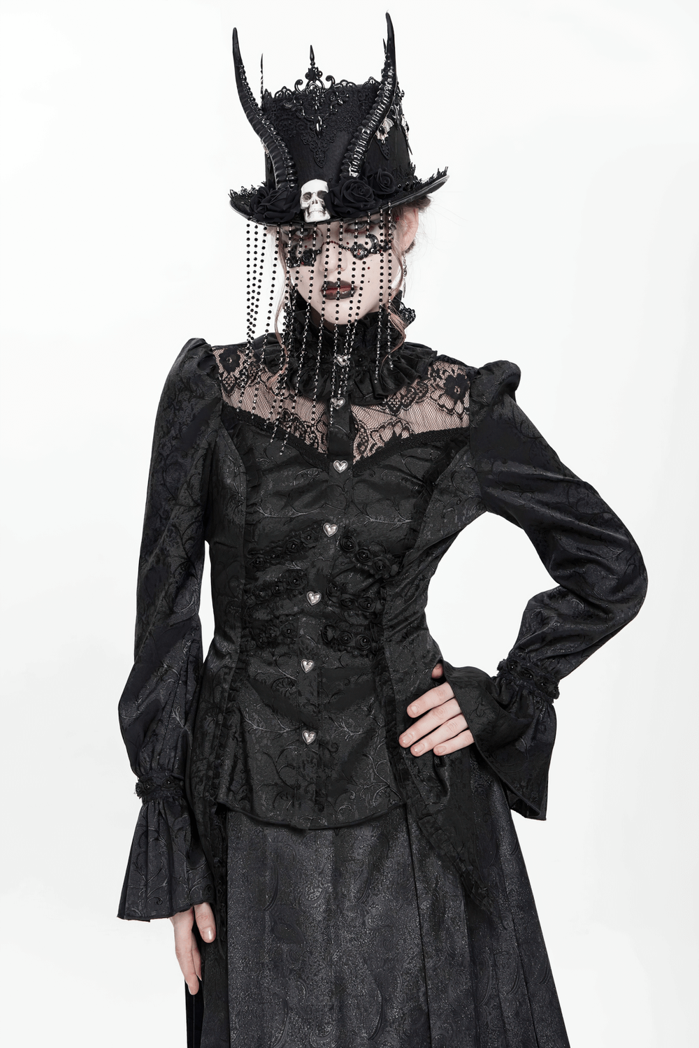 Victorian-inspired gothic blouse with lace, high neck, heart buttons, dramatic sleeves, and a unique black hat.