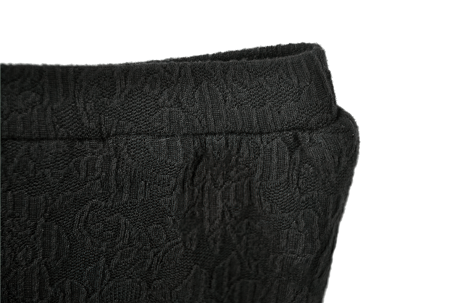 Close-up of the gothic high-waist shorts showcasing intricate black lace texture and structured waistband.