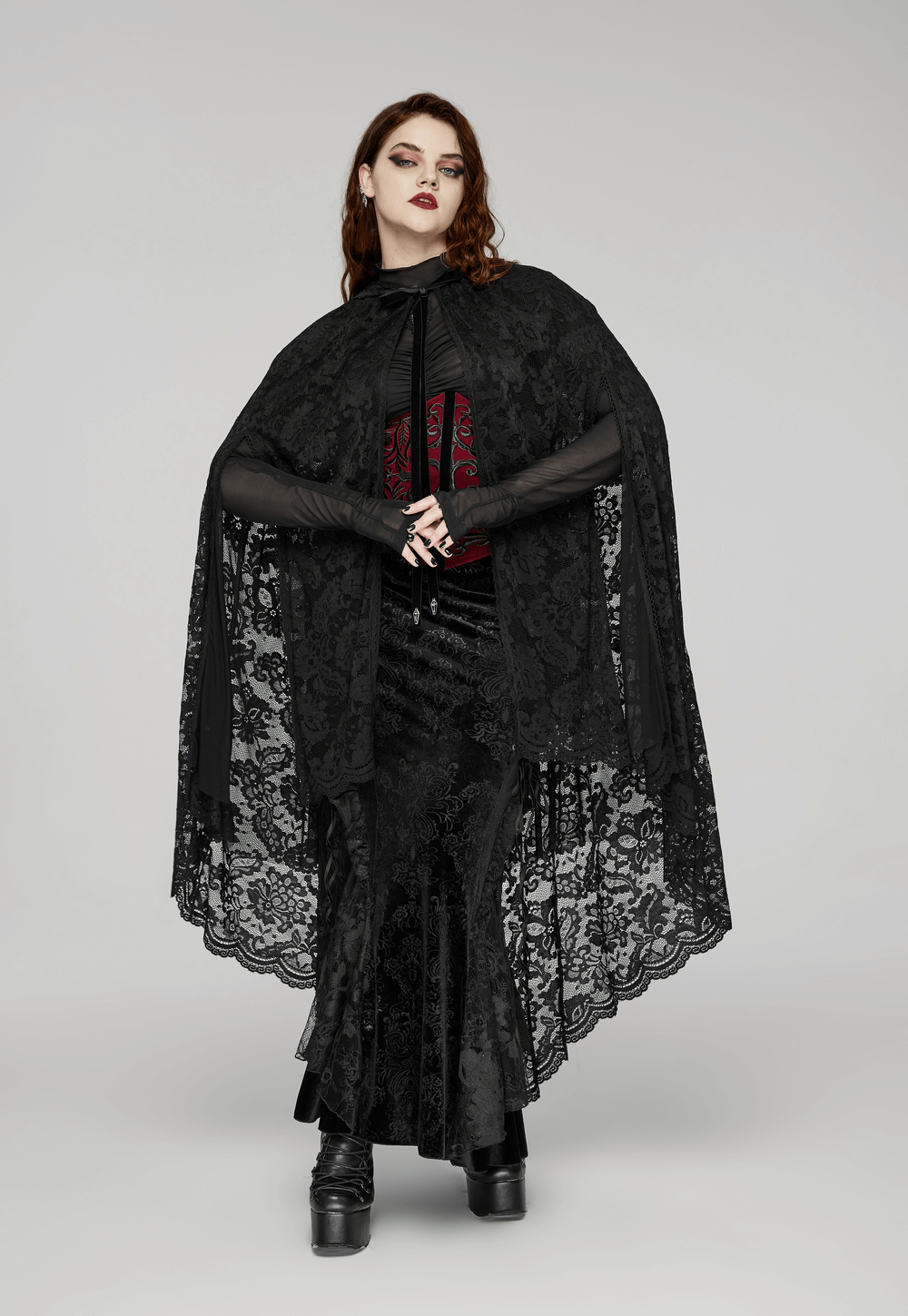Elegant Gothic lace hooded cape with rose trim worn over a dark outfit, perfect for dramatic dark fashion.