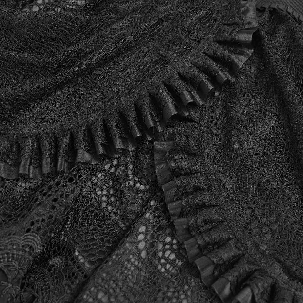 Close-up of intricate black lace and ruffled details on a gothic skirt, showcasing elegant texture and design.