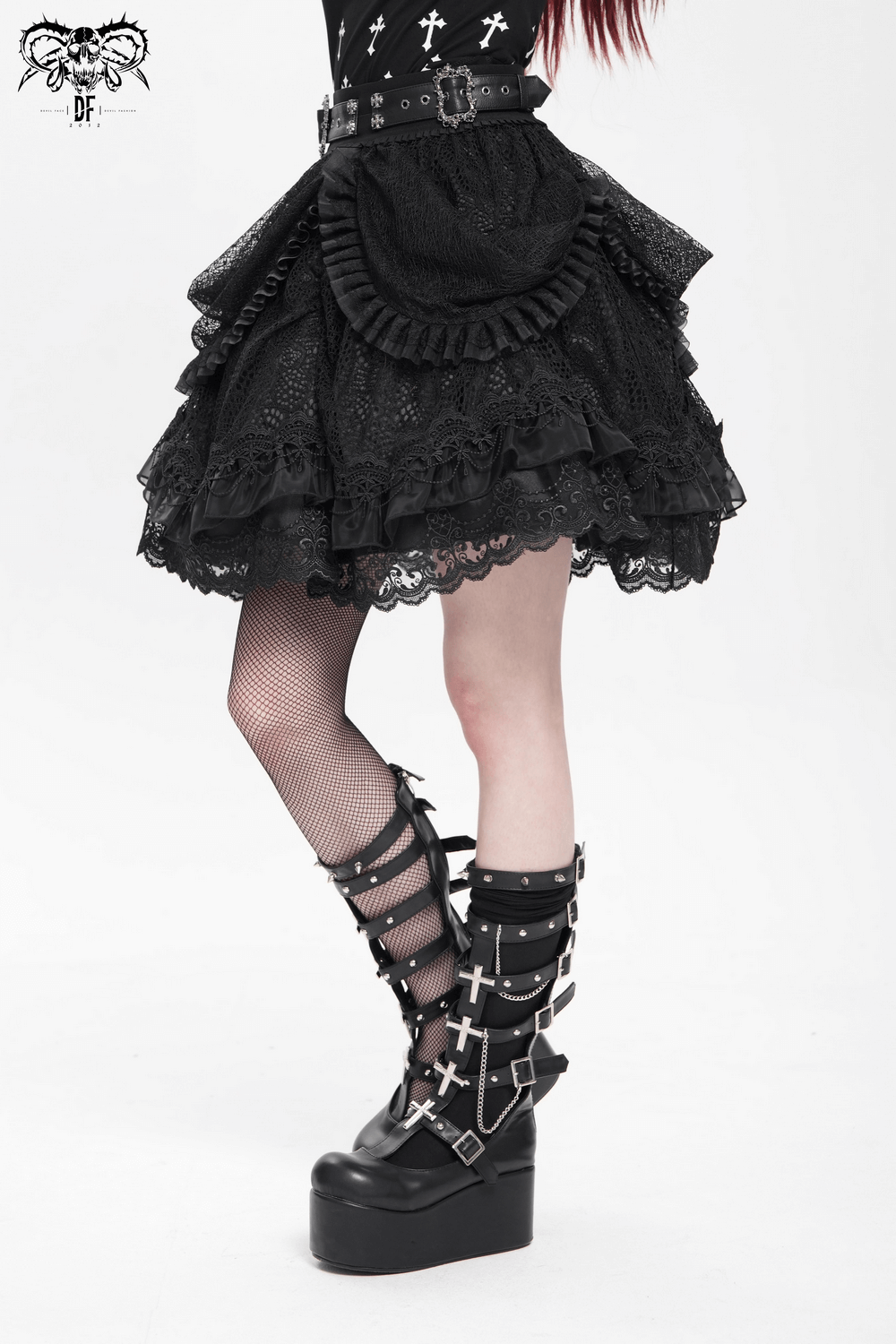Gothic lace skirt with layered ruffles, buckle belts, and dramatic drapes paired with edgy platform boots.