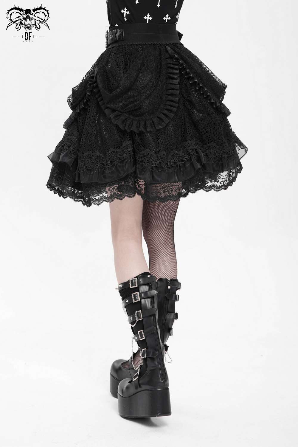 Gothic lace layered skirt with ruffles, buckle details, and stylish black boots in dramatic steampunk look.