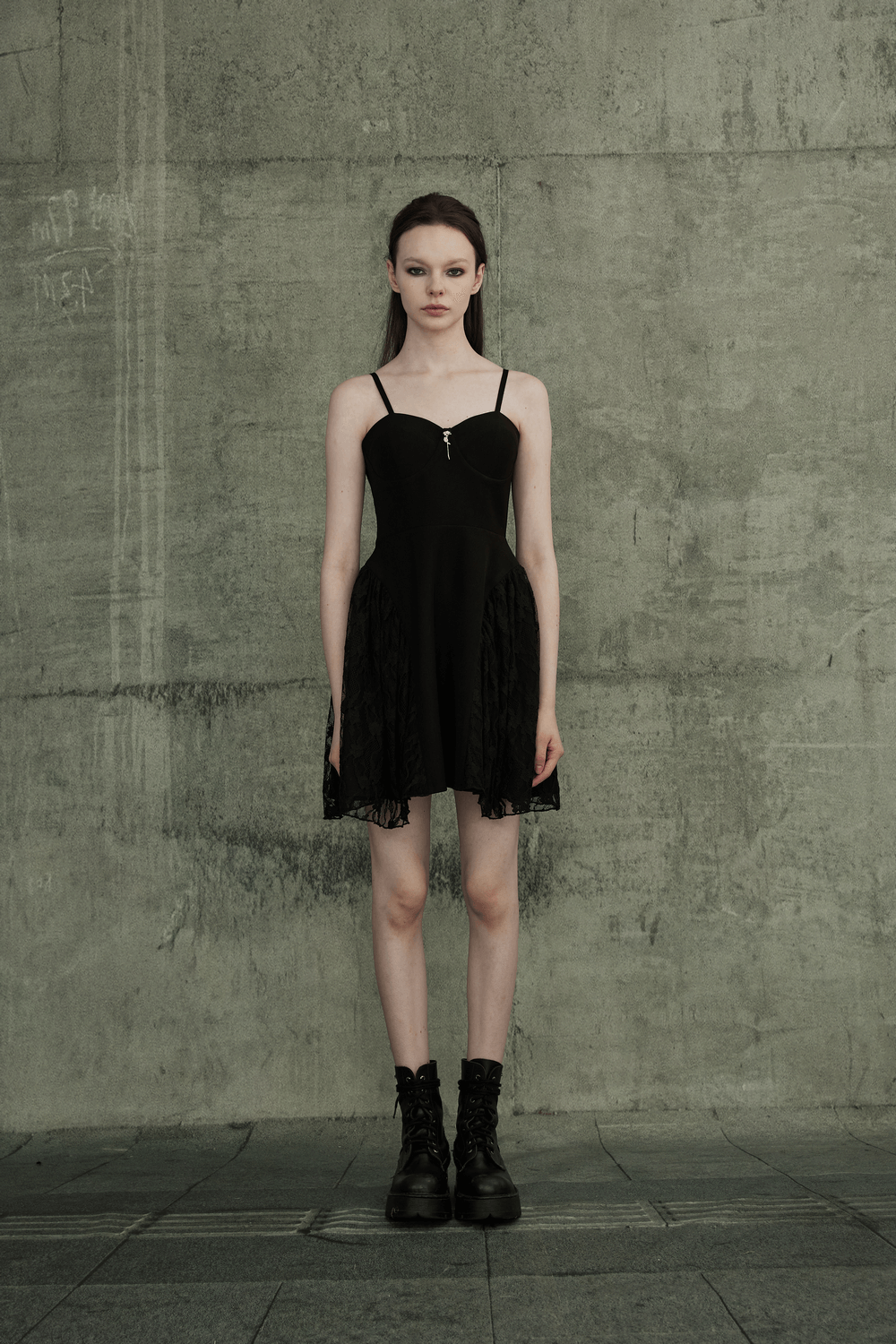 Model wearing a black Gothic lace mesh slip dress with adjustable straps and punk rave style, perfect for parties.