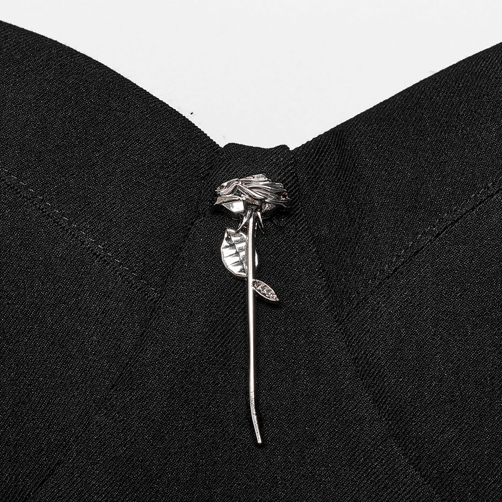 Close-up of metal rose decoration on Gothic slip dress, enhancing the punk rave aesthetic.