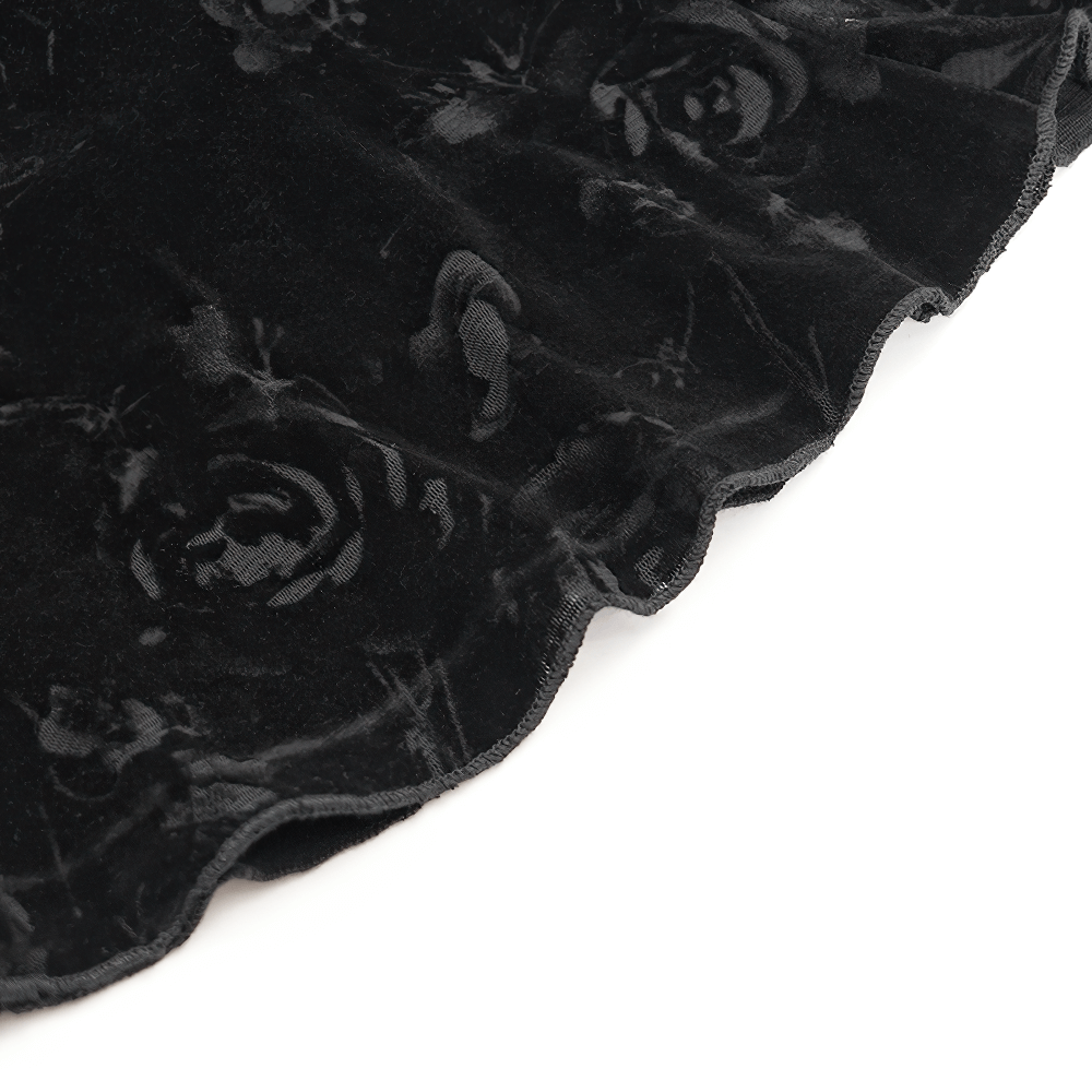 Close-up of black lace fabric featuring floral patterns, perfect for gothic and alternative fashion.