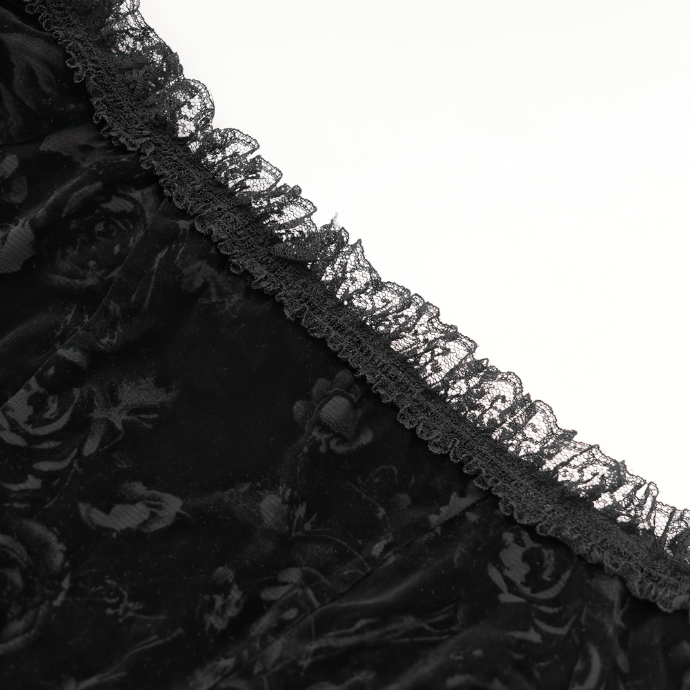 Close-up of the lace neckline on a Gothic black off-shoulder top with floral embroidery and sheer mesh.