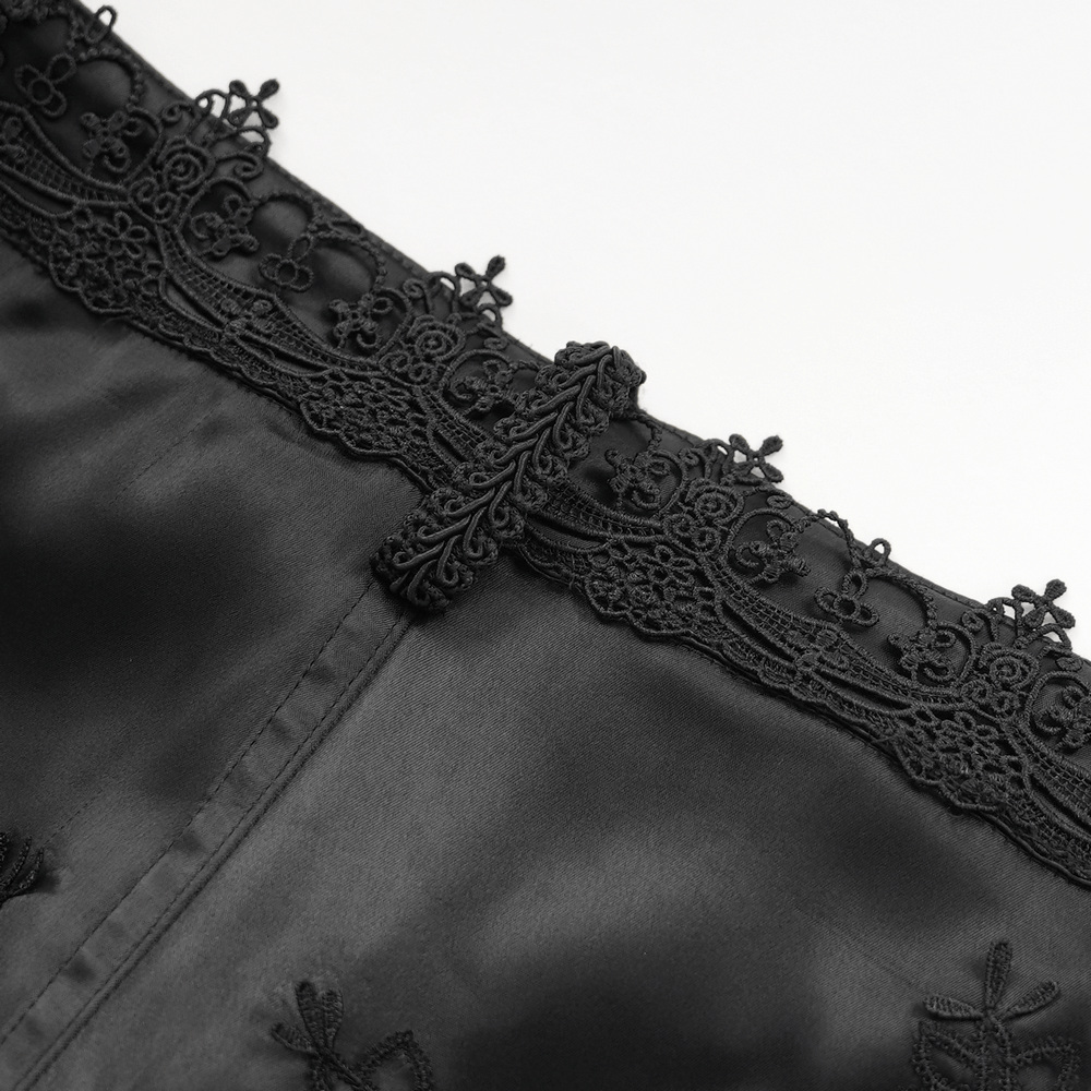 Close-up of intricate black lace detailing on satin fabric for gothic fashion. Perfect for dramatic style.