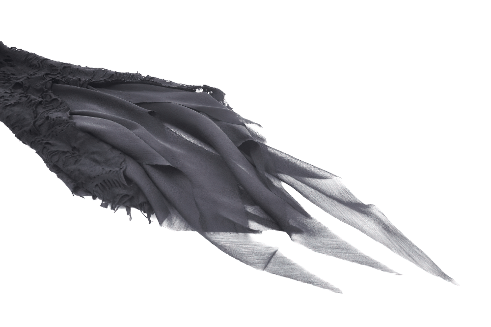 Flowing black fabric from a gothic lace ripped hoodie, showcasing intricate rips and sheer texture.
