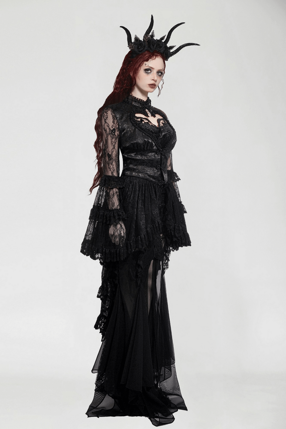 Gothic lace cape with ruffled bell sleeves and heart cutout, perfect for alternative fashion statements.